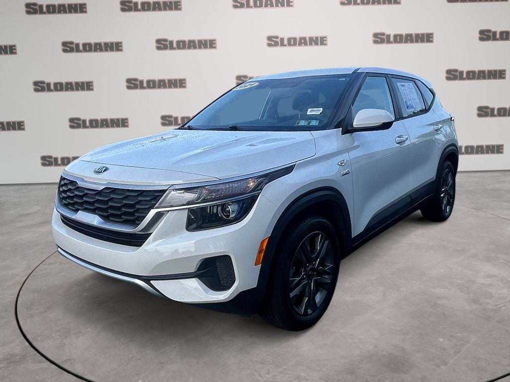 2021 Kia Seltos LX in Snow White Pearl — front three-quarter view