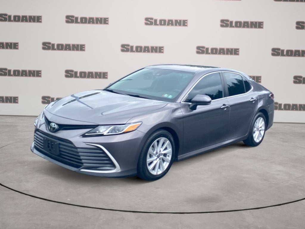 2023 Toyota Camry LE in Predawn Gray Mica — front three-quarter view