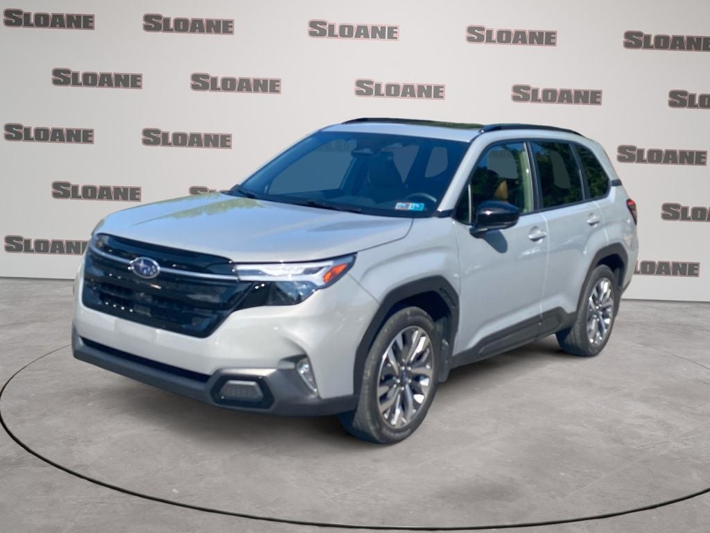 2025 Subaru Forester Touring in Pearl — front three-quarter view