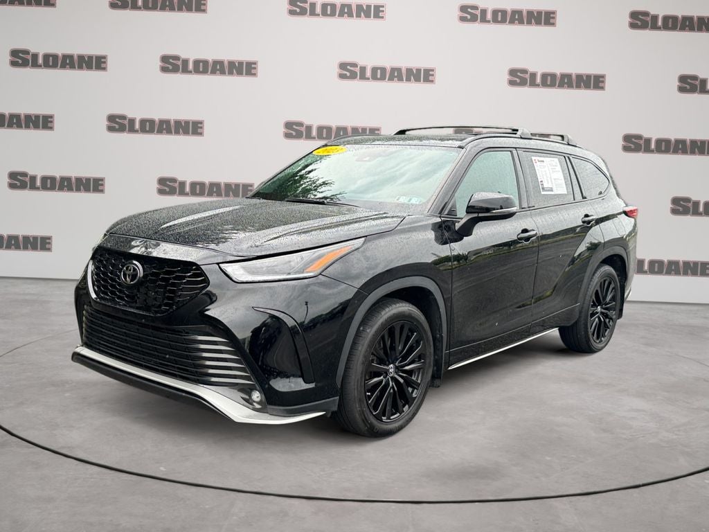 2023 Toyota Highlander XSE in Midnight Black Metal — front three-quarter view