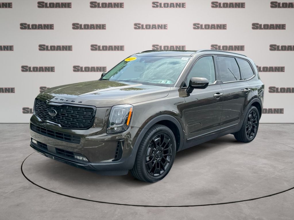 2021 Kia Telluride SX in Dark Moss — front three-quarter view