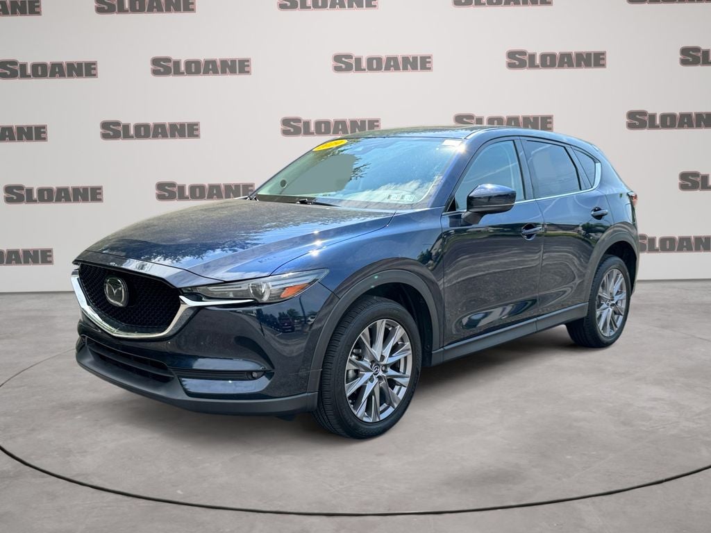 2019 Mazda Mazda CX-5 Grand Touring in Crystal Blue — front three-quarter view