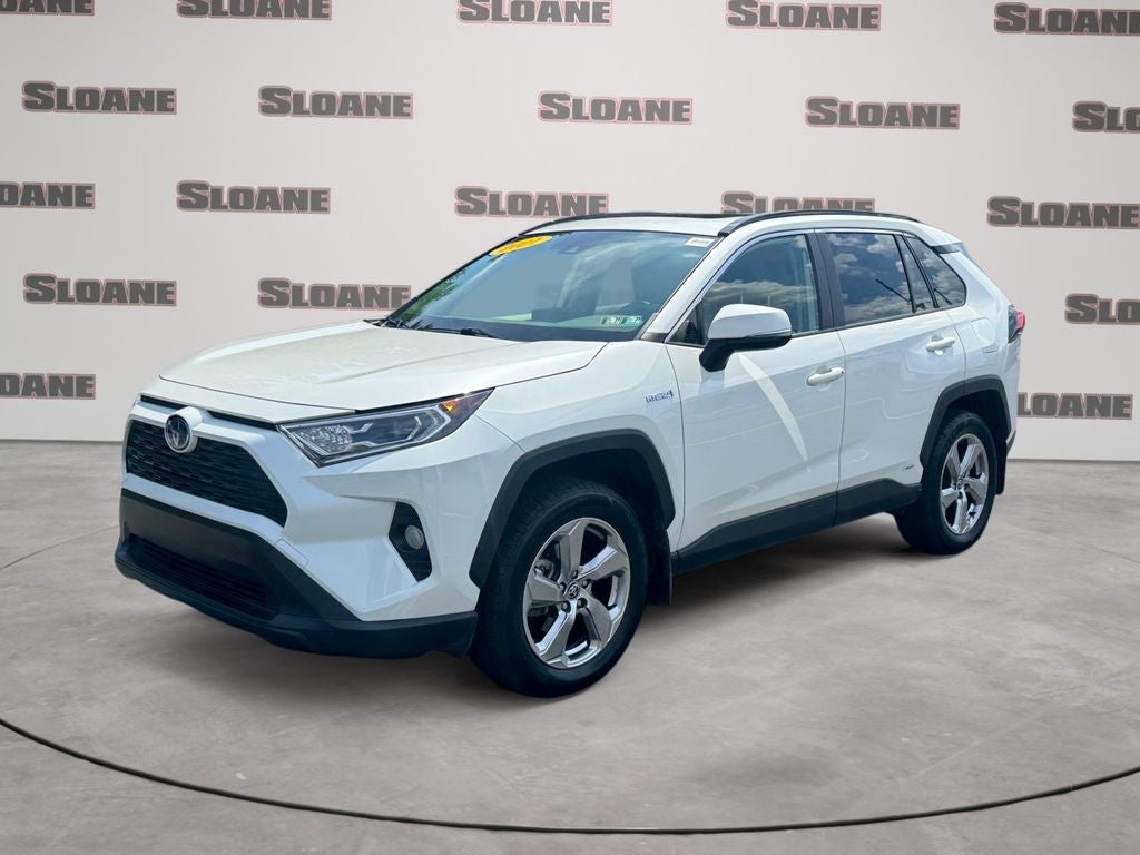 2021 Toyota RAV4 Hybrid XLE Premium in Blizzard Pearl — front three-quarter view