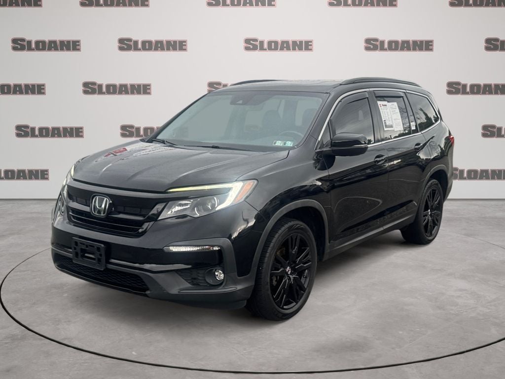 2021 Honda Pilot Special Edition in Obsidian Blue Pearl — front three-quarter view